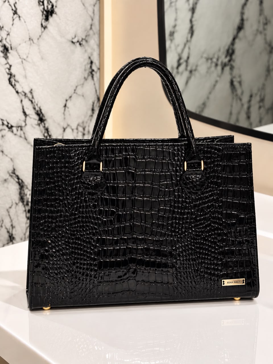 Black crocodile-textured maxi tote bag with top handles